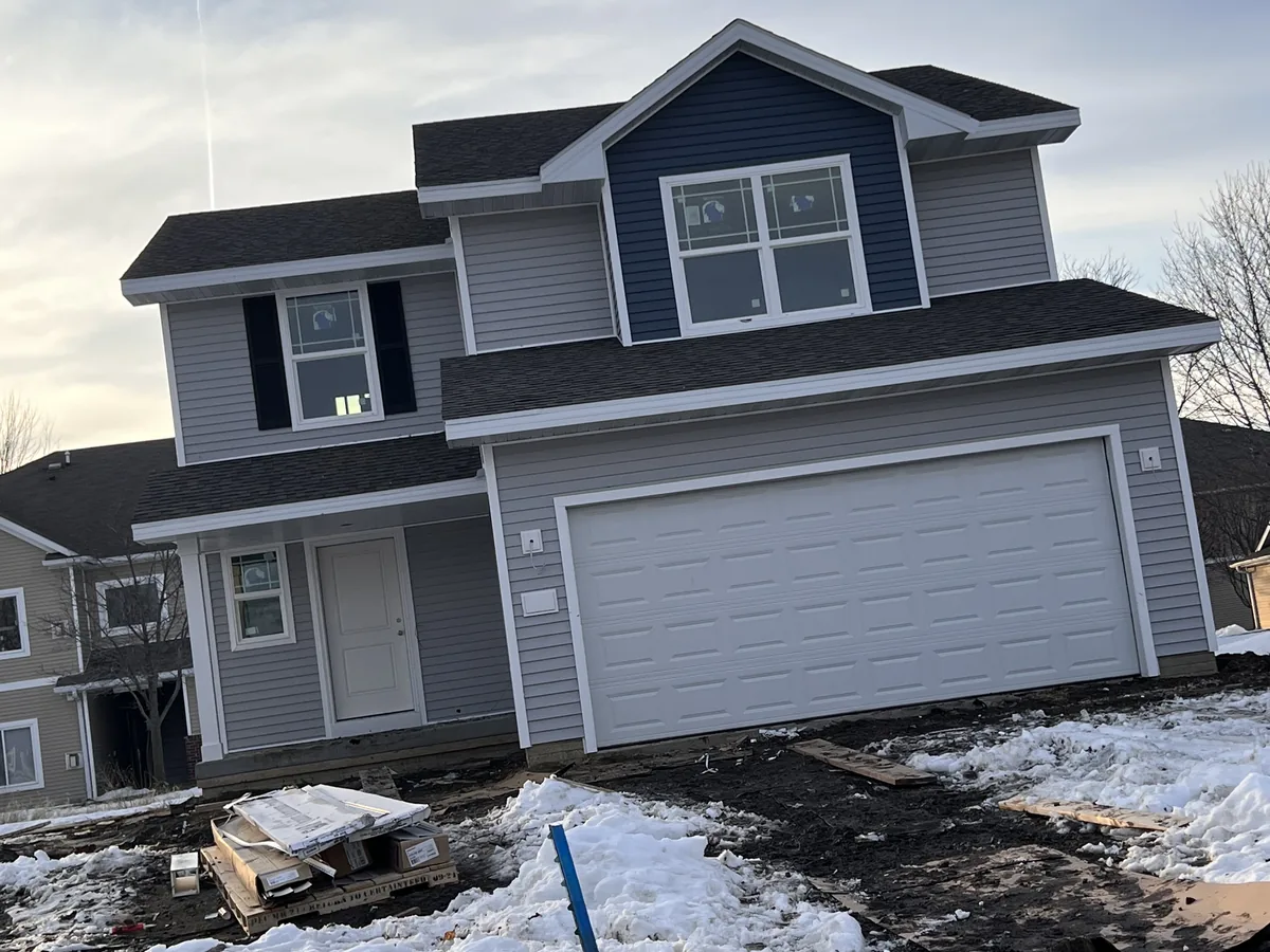Blue and gray two-tone siding on a two-story home